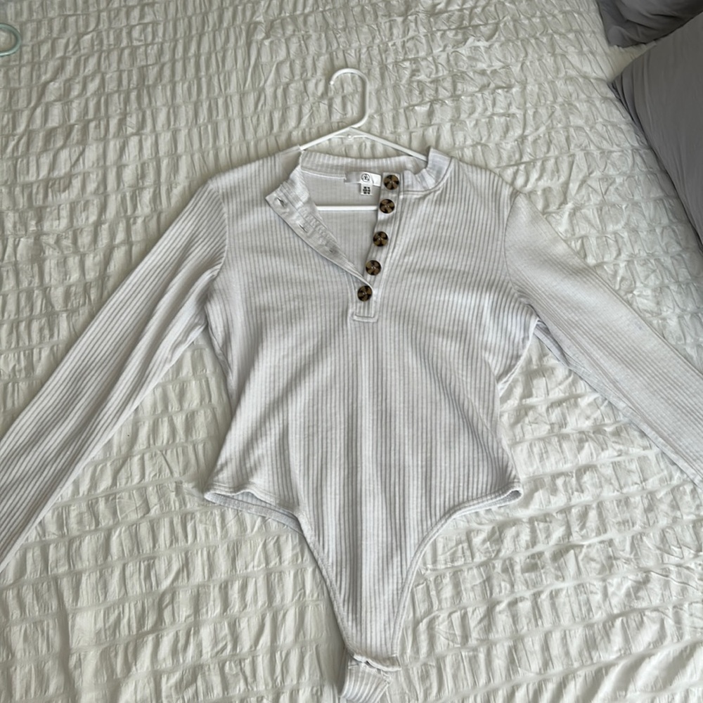 Missguided brand white ribbed snap body suit with front buttons